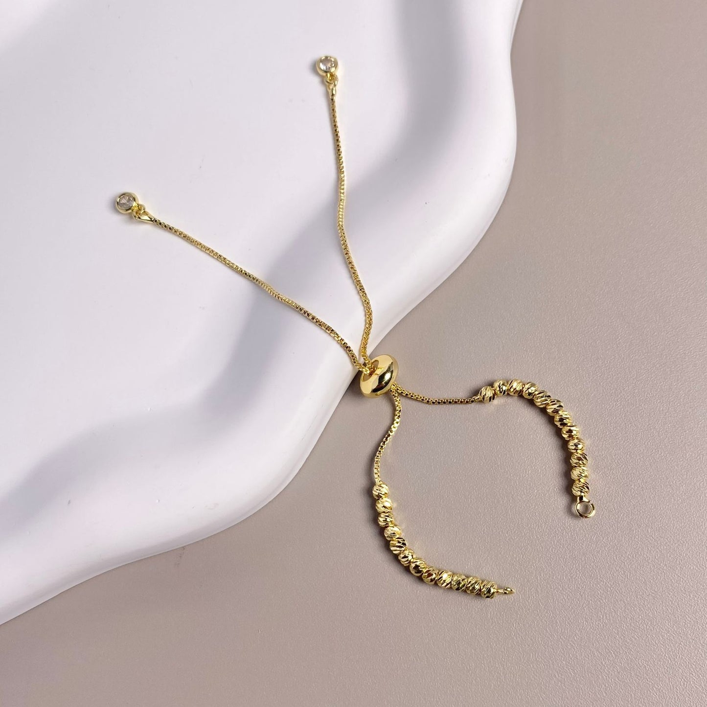 PULSERA ENSAMBLE DORADO