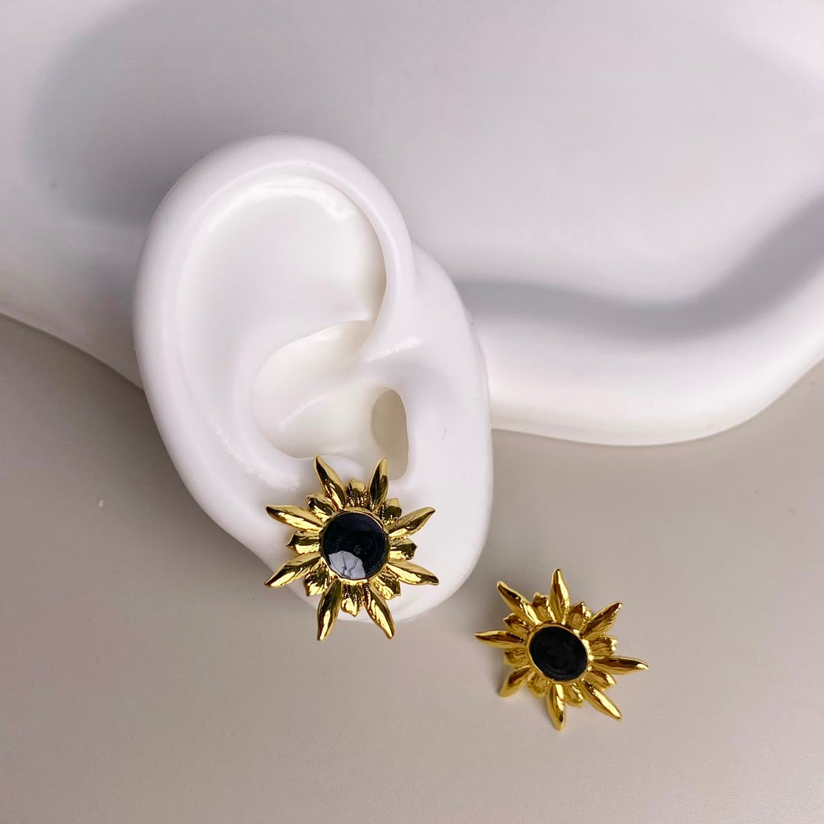 ARETES SOL NEGRO